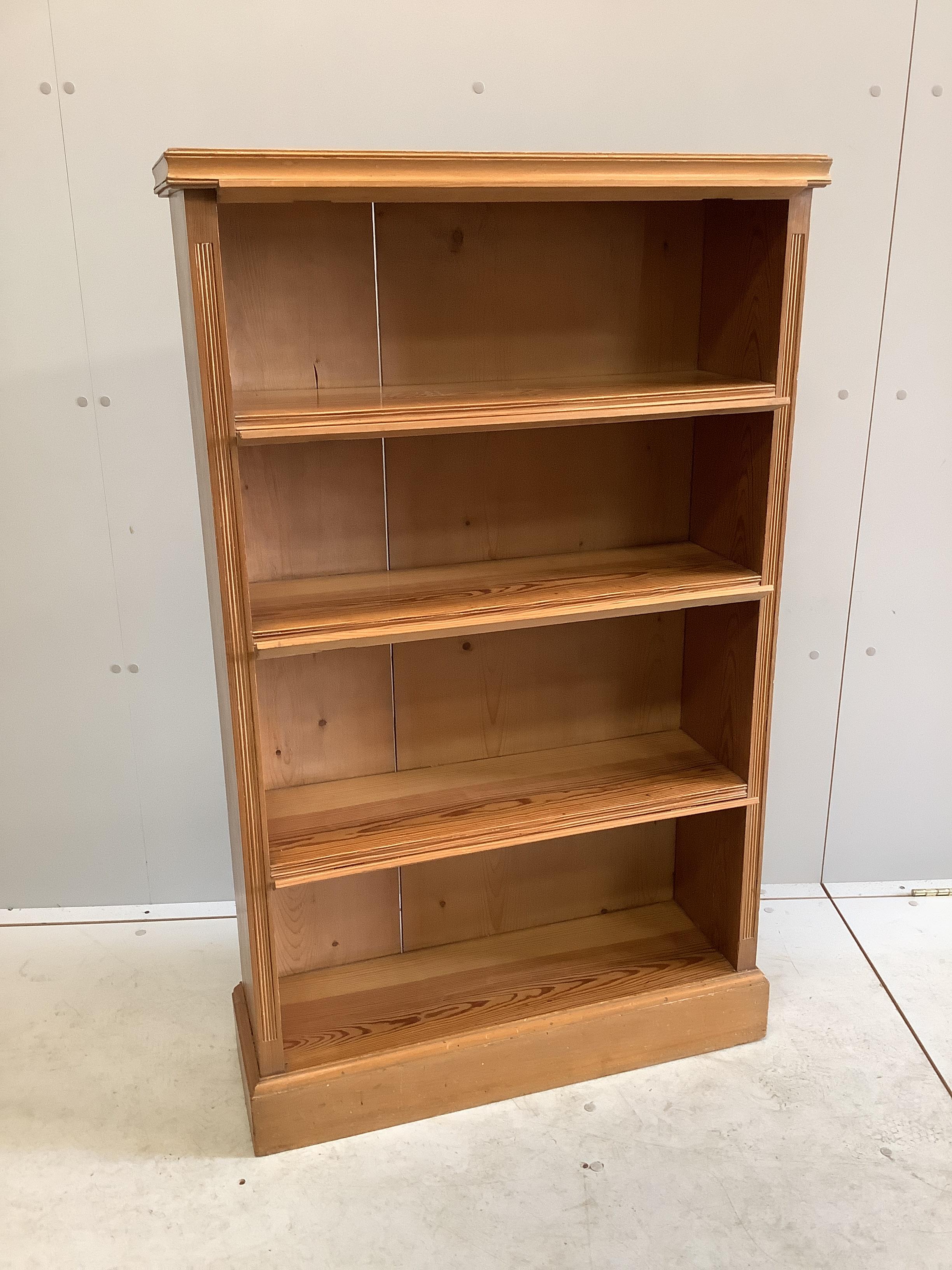 An early 20th century pitch pine open bookcase, width 75cm, depth 25cm, height 122cm